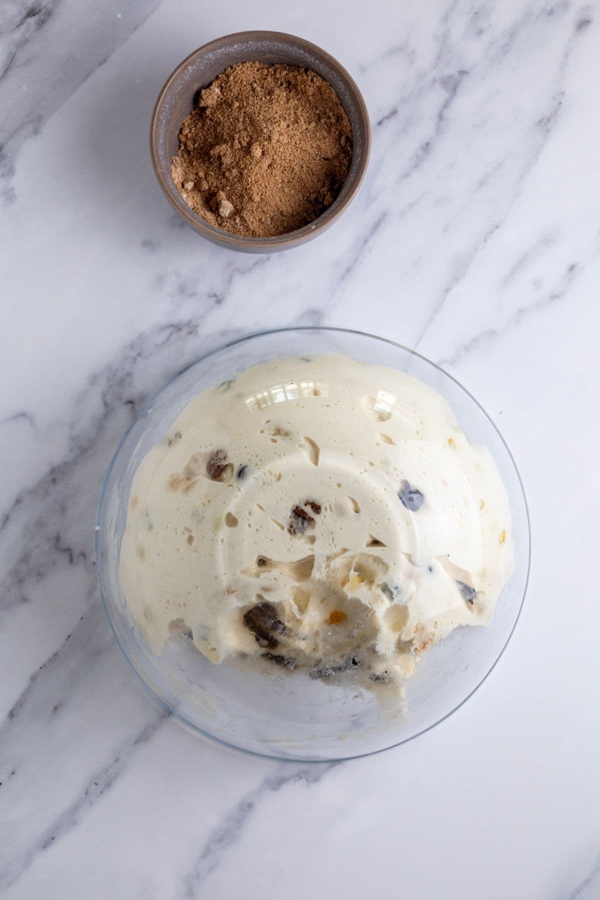 The dough can be tipped out of the bowl easily at the end of bulk fermentation and this image shows the glass bowl tipped upside down on the counter and the dough easily falling out without leaving any residue on the bottom of the bowl.