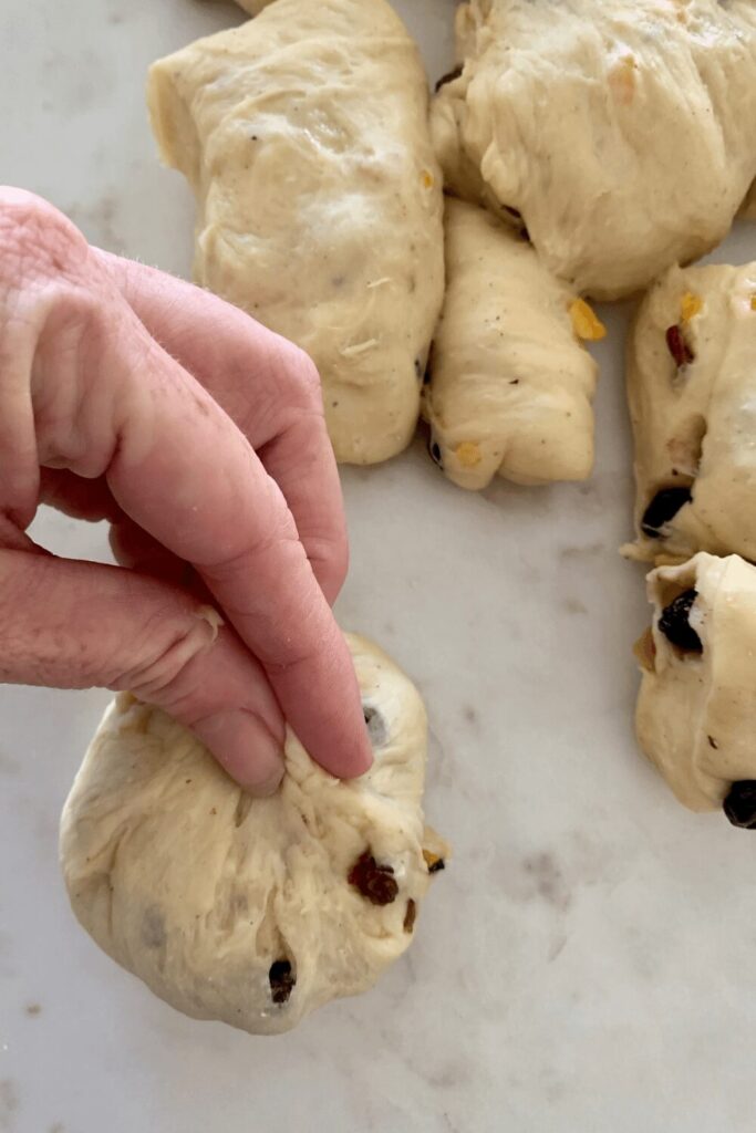 Shaping sourdough hot cross buns