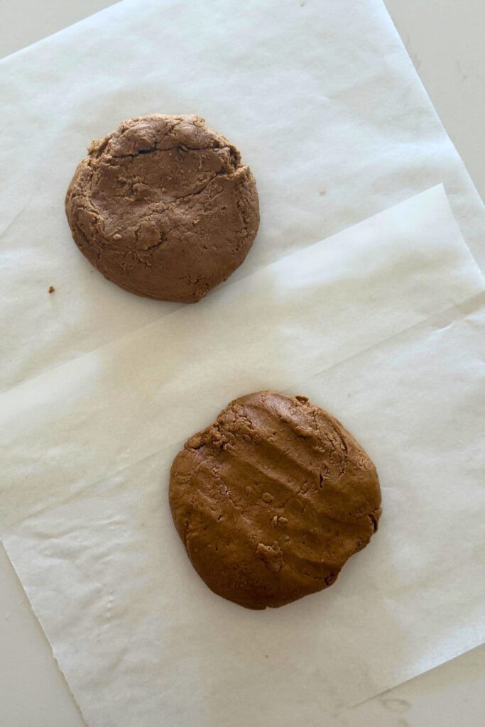 Sourdough gingerbread cookies that has been divided into two portions.