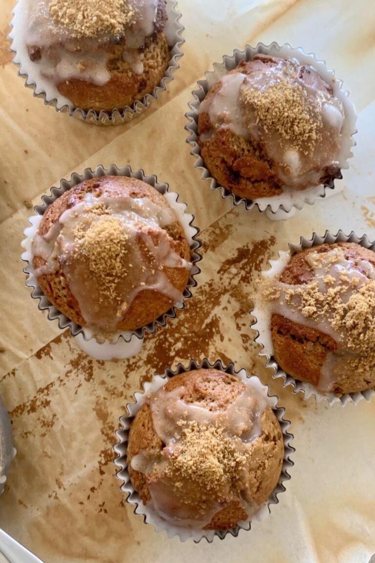 Sourdough gingerbread muffins topped with sugar glaze and sourdough gingerbread dust