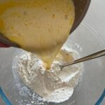 Sourdough Discard Waffles Recipe - adding liquid ingredients to dry ingredients.