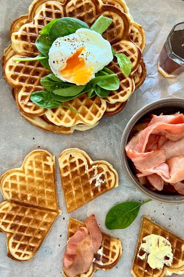 Overnight Sourdough Waffles served with bacon, eggs and maple syrup