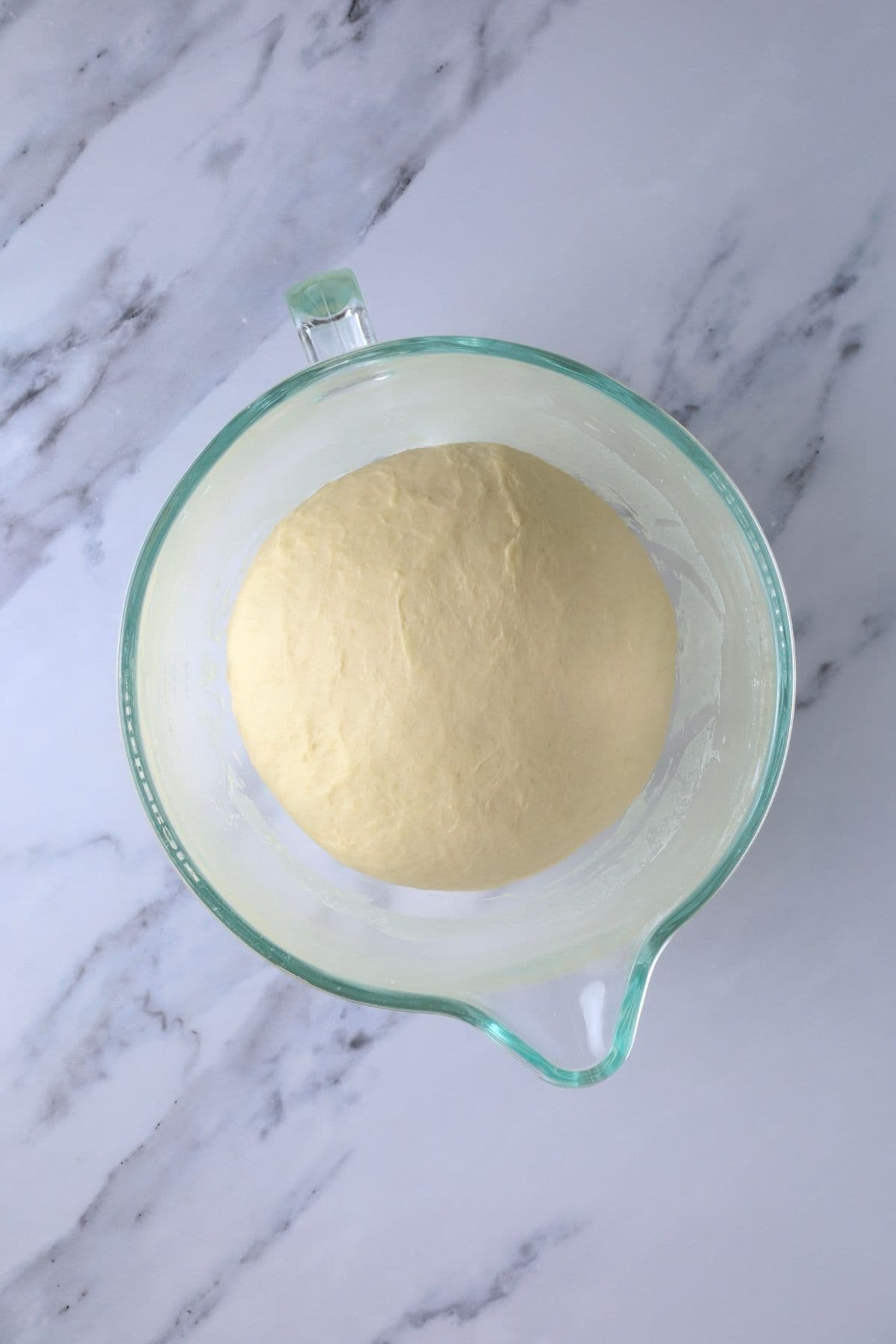 Dough for making sourdough discard rolls that has risen until double.