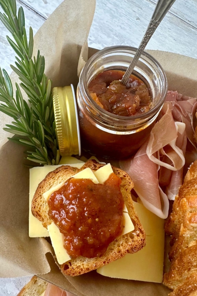 Sourdough crostini topped with cheddar cheese and tomato relish.