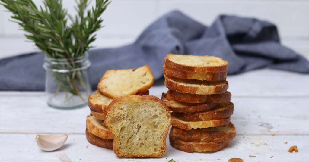 Sourdough crostini stacked up to form a little tower.