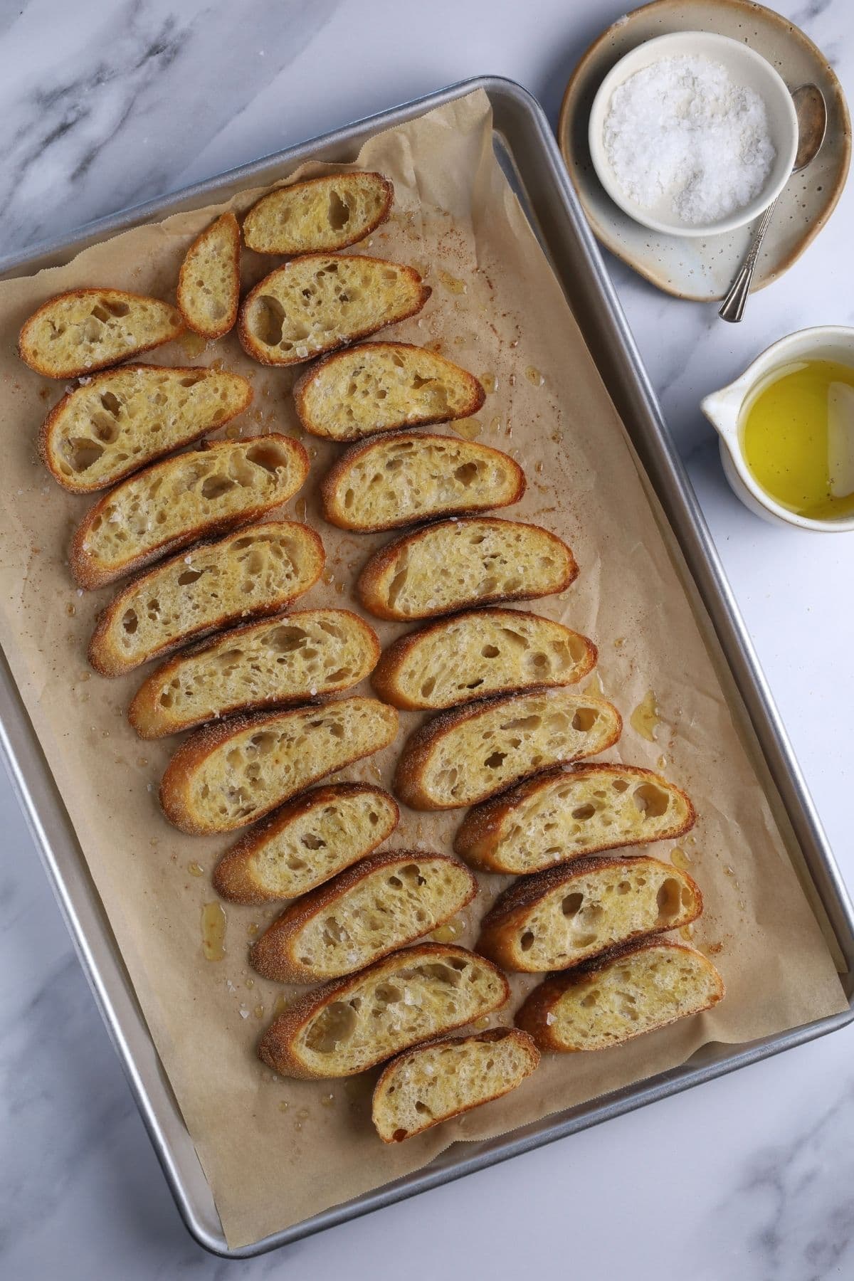A batch of crunchy sourdough crostini fresh out of the oven. 