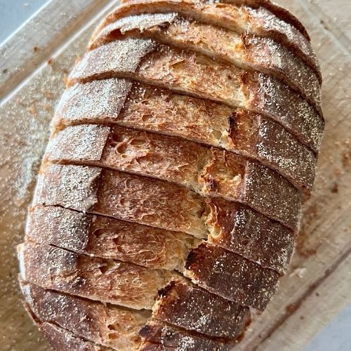 Sourdough Garlic Bread Recipe - slice the loaves while leaving them still attached at the bottom.