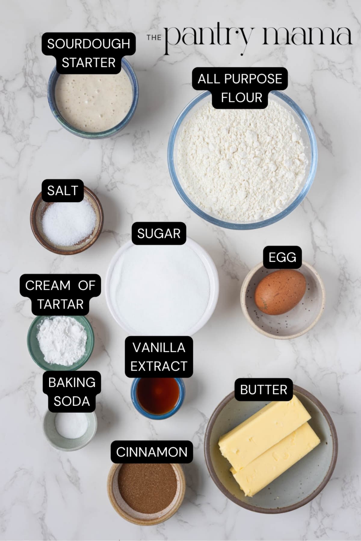 A flat lay of ingredients necessary for making sourdough snickerdoodle cookies.