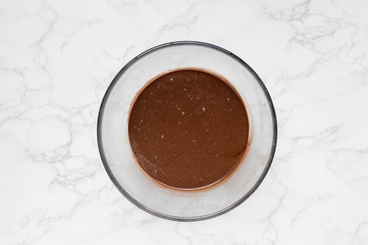 Chocolate cake mixture combined in a bowl, creating the base for the sourdough chocolate cake batter.