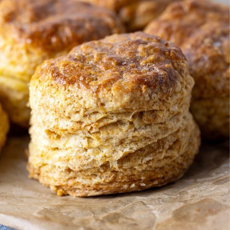 A close up photo of a flaky sourdough biscuit.