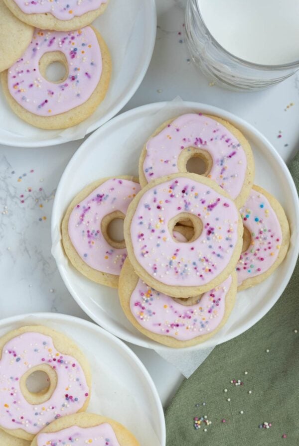 A photo of sourdough sugar cookies that have been decorated to look like little pink donuts.