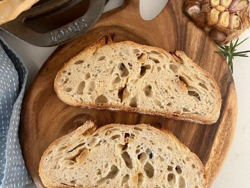 Roasted garlic asiago sourdough. Made in a Lodge Dutch oven and a