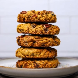 A stack of sourdough breakfast cookies on a white plate.