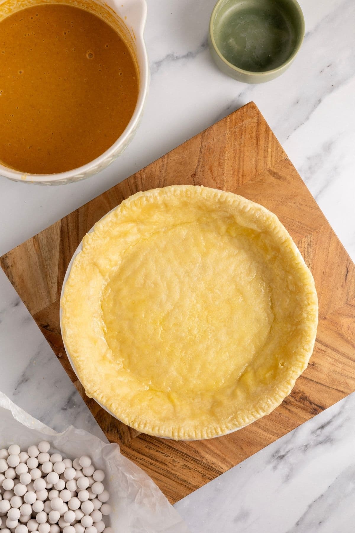 An image showing the pastry that has been blind baked.