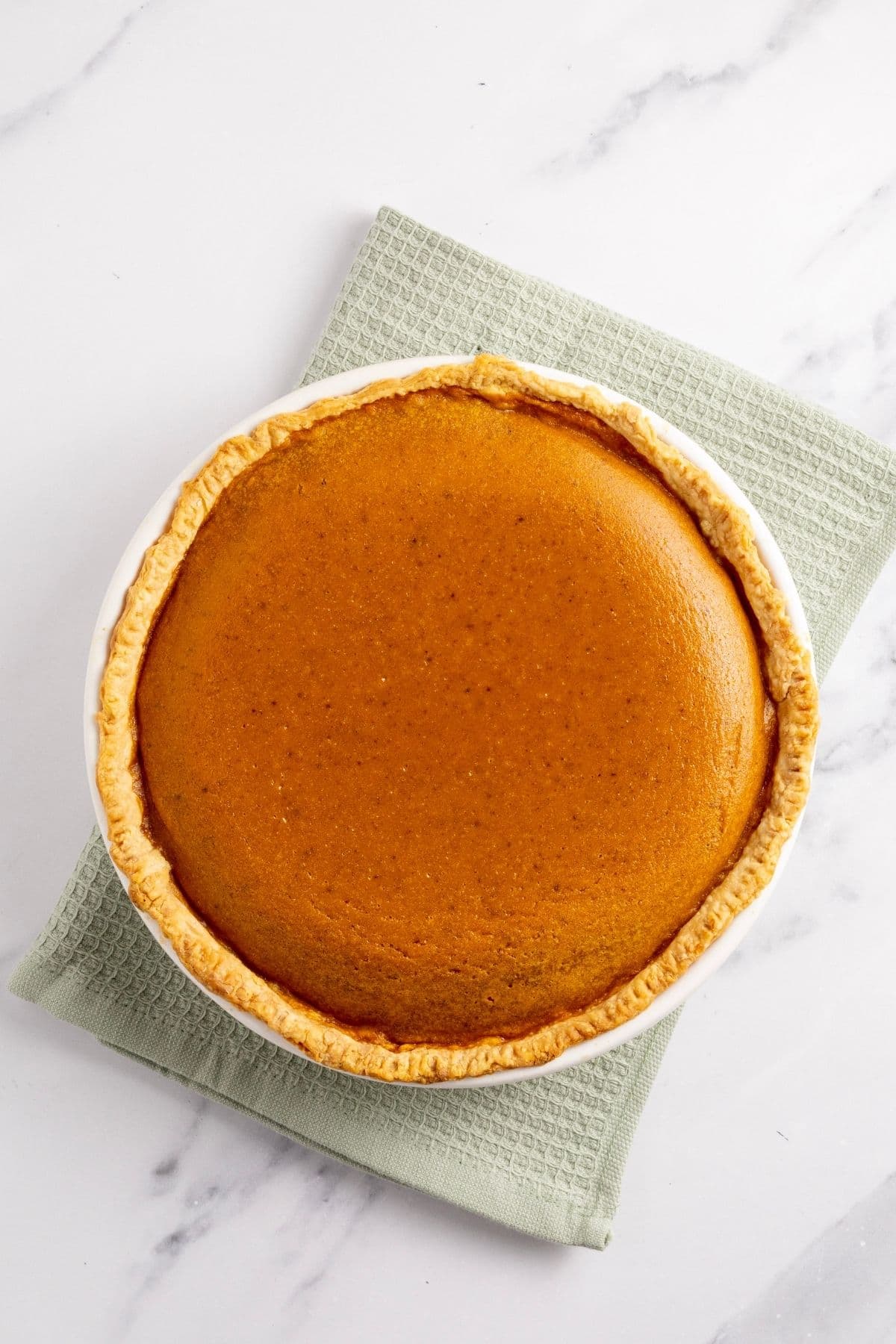 A top down image of the freshly baked pumpkin pie.
