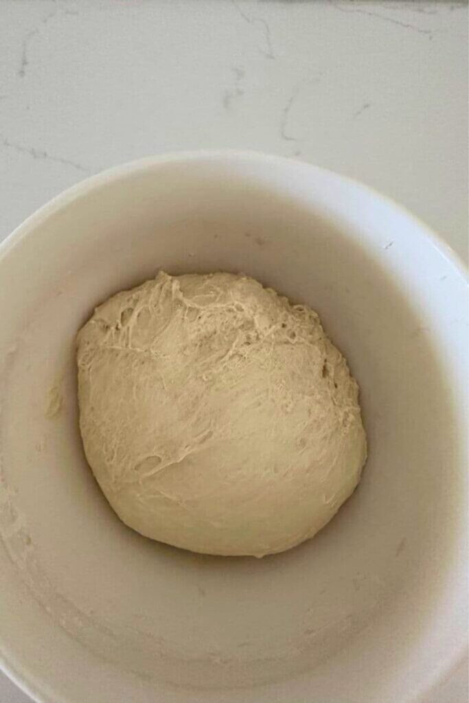 Sticky ball of sourdough ciabatta dough ready to go into the fridge.