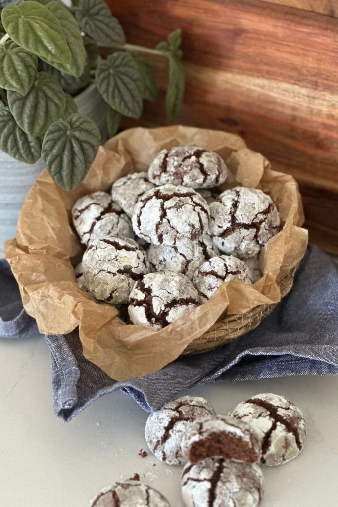 A tin of sourdough chocolate crinkle cookies.