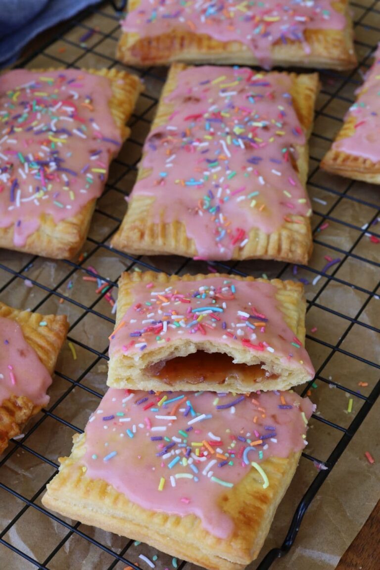 Strawberry sourdough pop tarts topped with strawberry frosting and sprinkles.