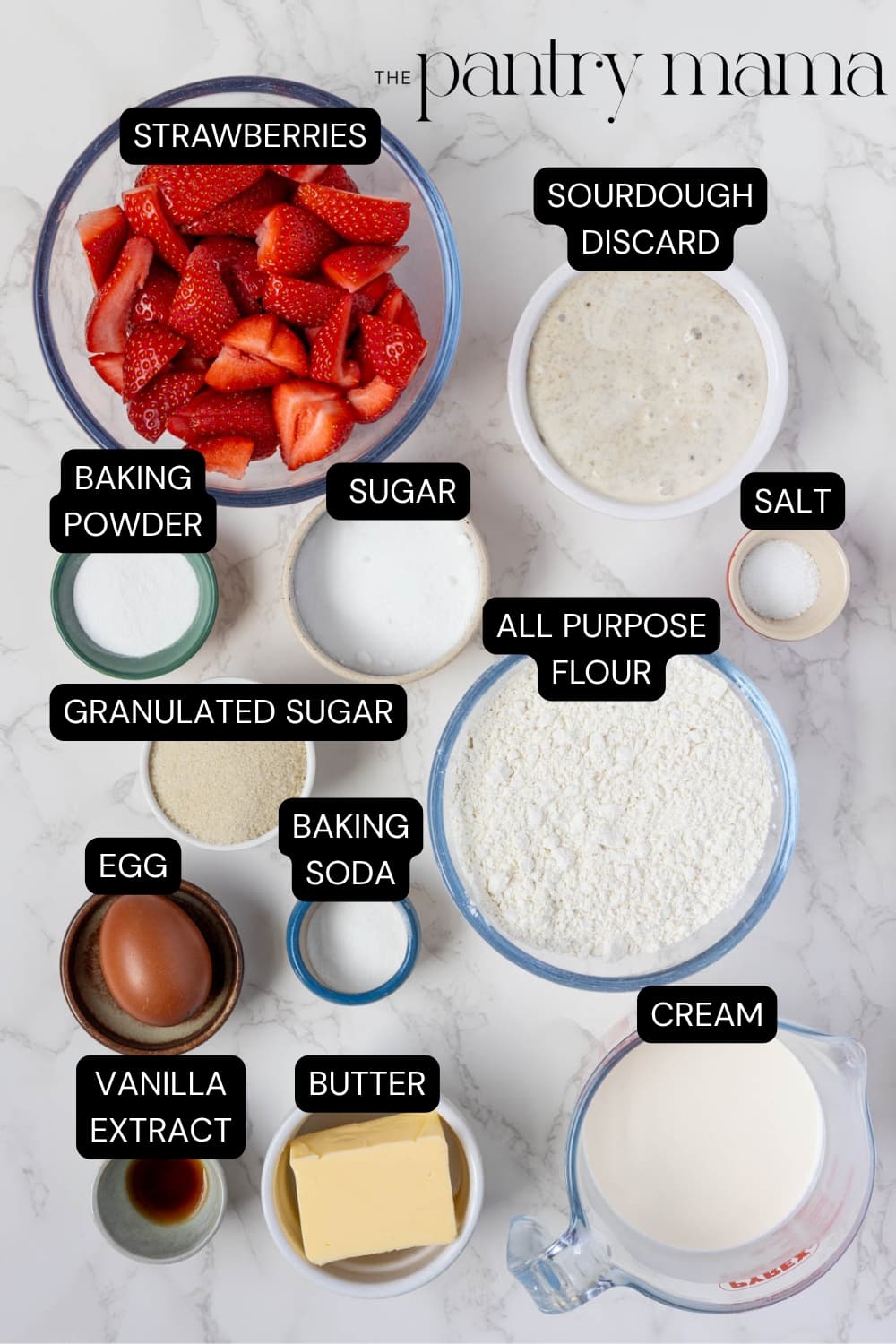 Flat lay of ingredients necessary to create a batch of sourdough strawberry shortcakes.