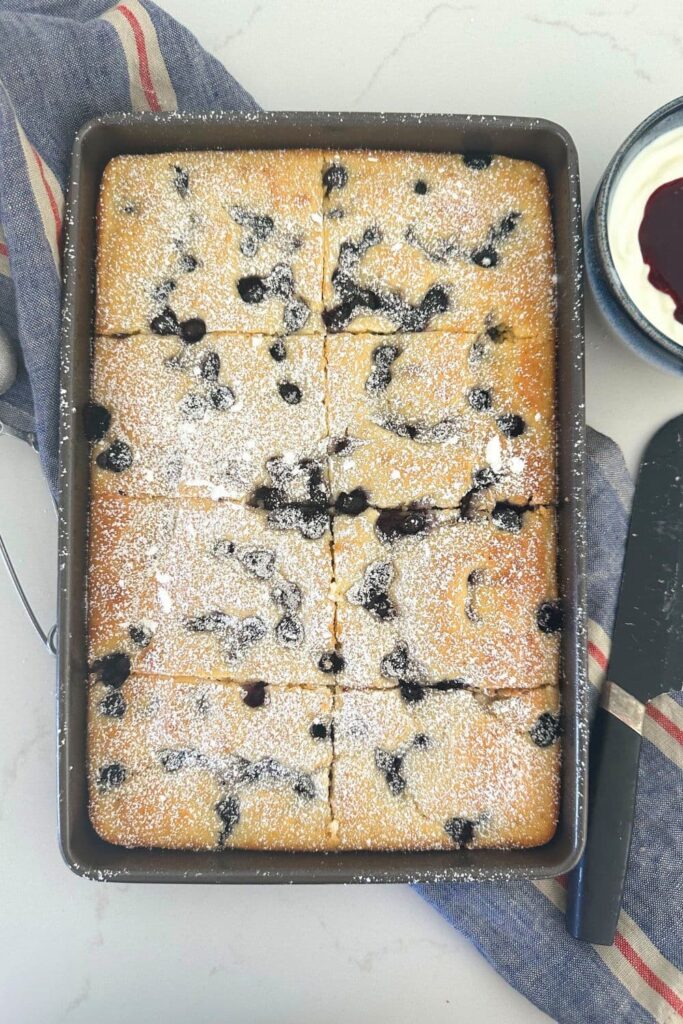 A tray of sourdough discard sheet pan pancakes studded with blueberries.
