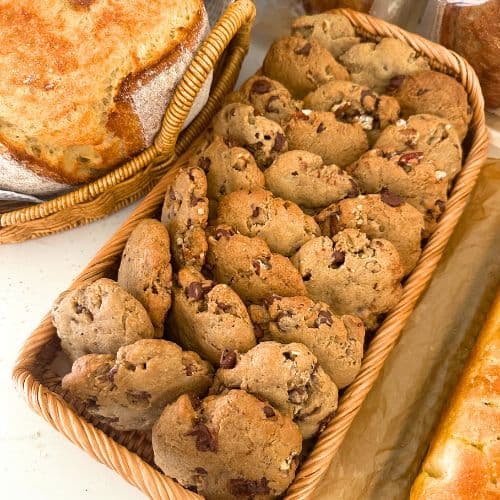 Spiced pecan sourdough cookies displayed in a rattan basket.