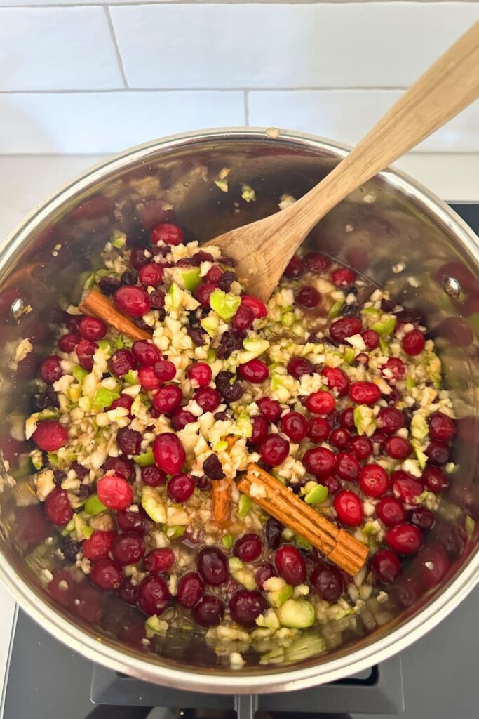 Christmas chutney as it cooks down. The ingredients are still brightly colored and whole at this stage but the cooking process has begun.