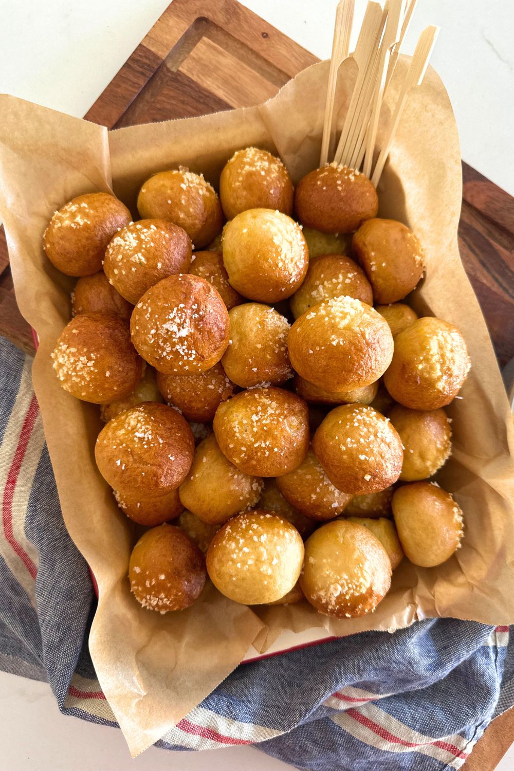 Sourdough discard bread bites in a parchment-lined basket.