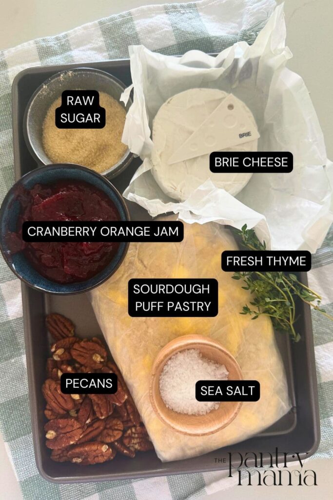 A flat lay of ingredients necessary to make sourdough Brie cranberry puff pastry tarts.