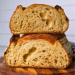 Crumb shot of hot honey sourdough bread cut in half.