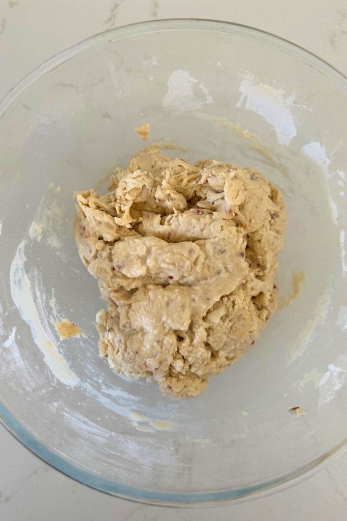 A bowl of shaggy dough that has just been mixed together to make hot honey sourdough bread.