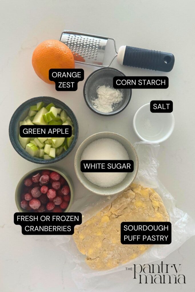 Flat lay of ingredients necessary to make sourdough apple and cranberry hand pies.