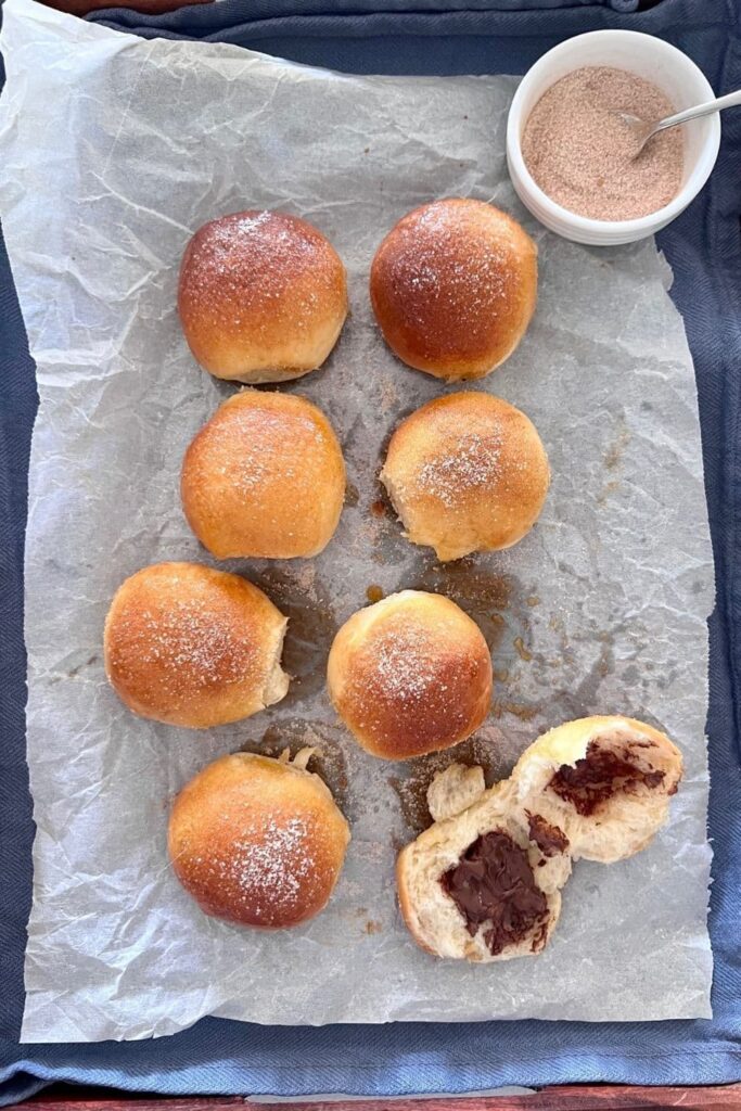 8 sourdough baked brioche donut balled filled with chocolate.