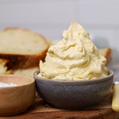 A small grey dish stacked high with whipped brown butter.