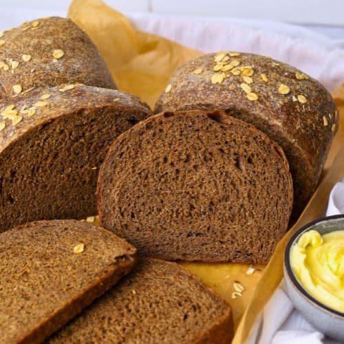 A loaf of sourdough brown bread that has been shaped into a sandwich loaf.