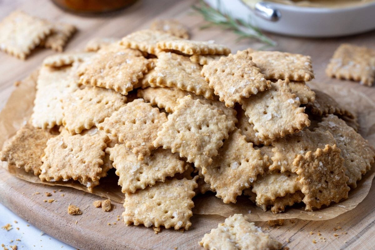 A generous stack of whole wheat sourdough crackers with frilly edges.