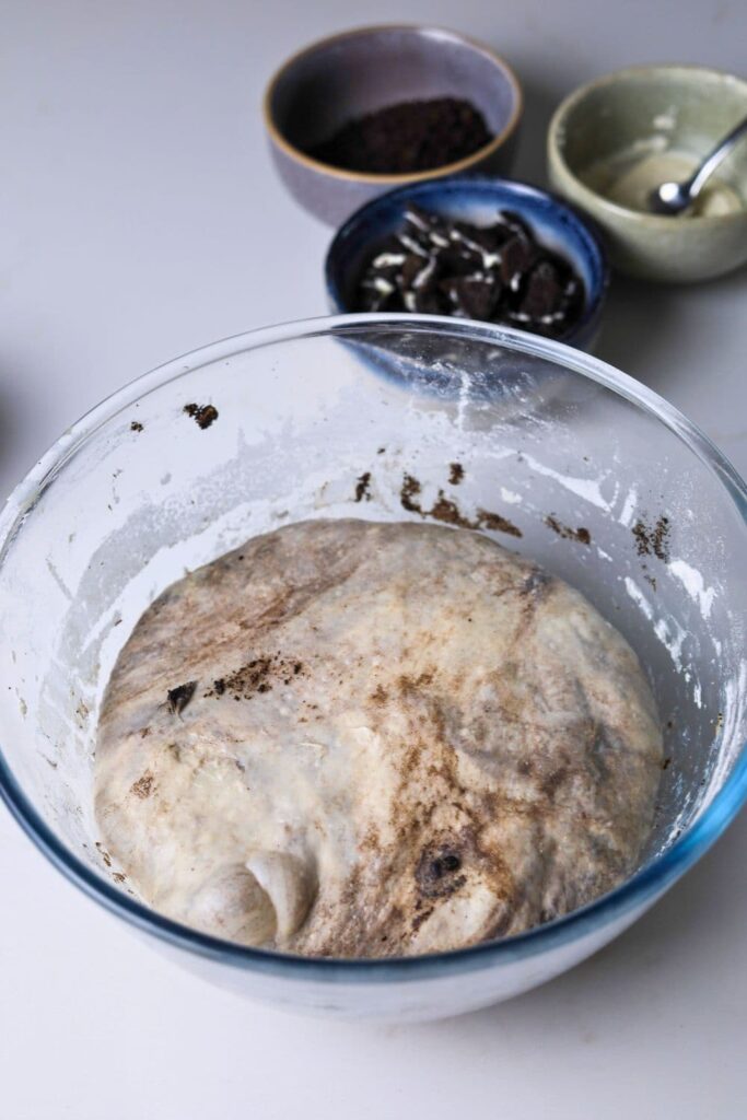 A bowl of dough that has doubled during bulk fermentation.