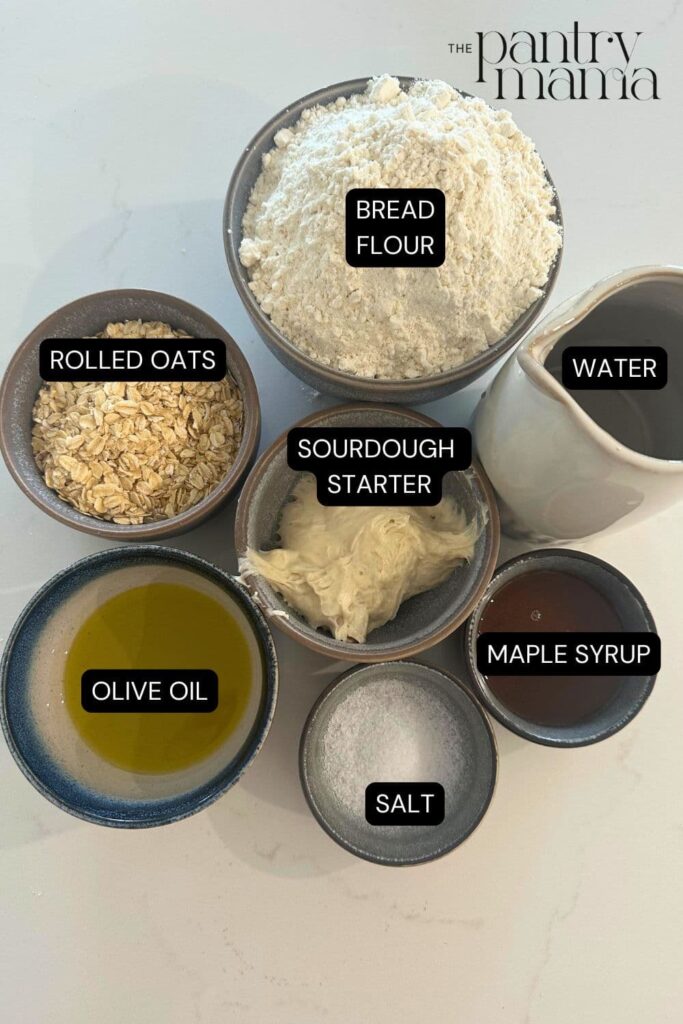 Flat lay of ingredients necessary to make Sourdough Maple Oat Sandwich Loaf.