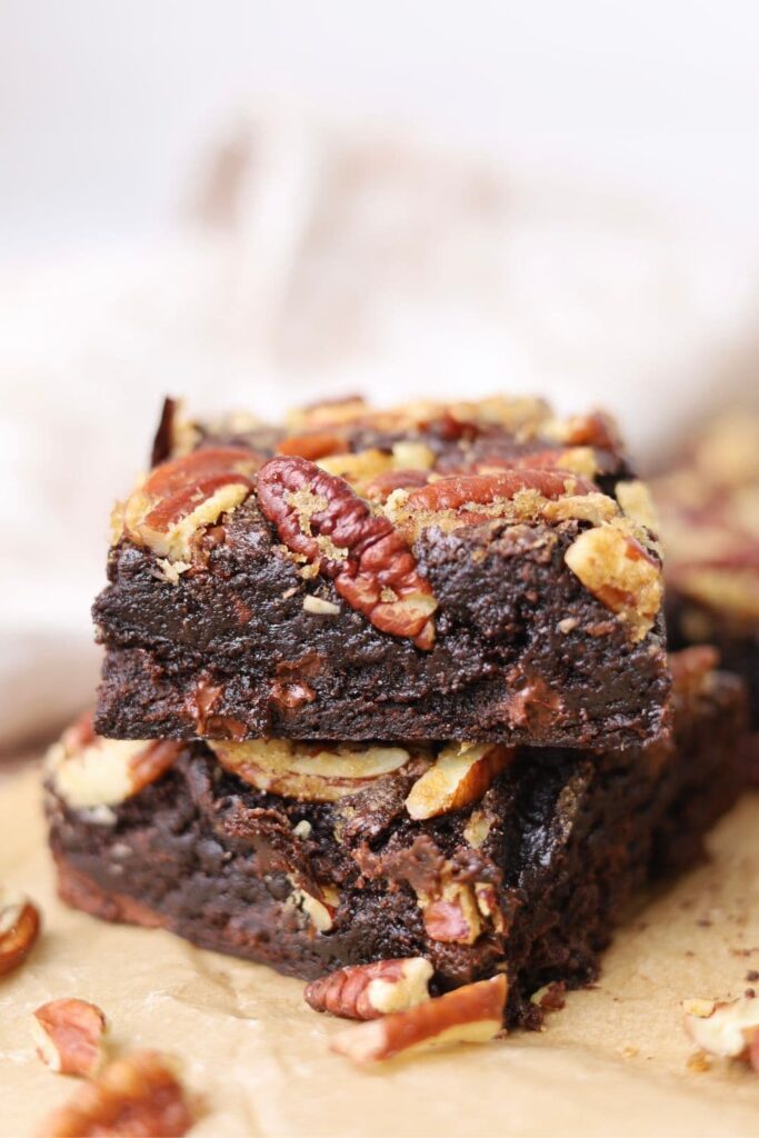 2 spiced sourdough brownies stacked on top of each other.