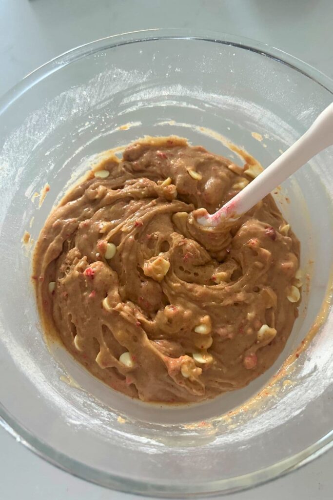 A bowl of sourdough strawberries and cream cookie dough mixed together.