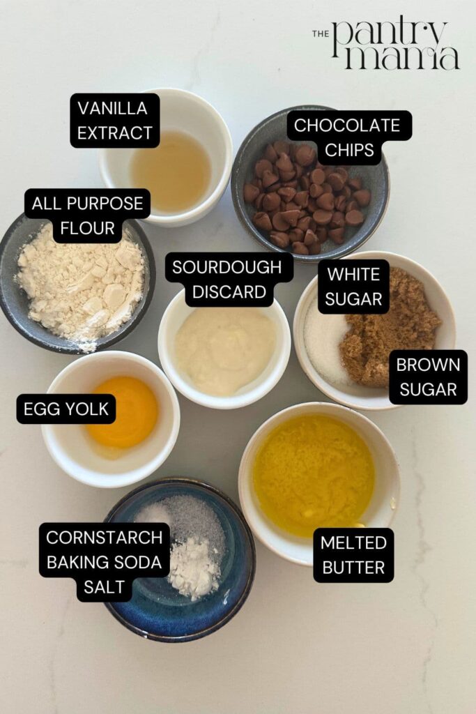 Flat lay of ingredients necessary to make a single serve sourdough chocolate chip cookie.