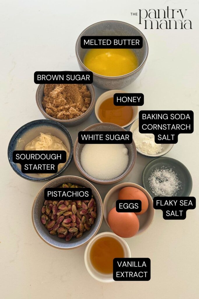 Flat lay of ingredients necessary to make sourdough honey pistachio cookies.