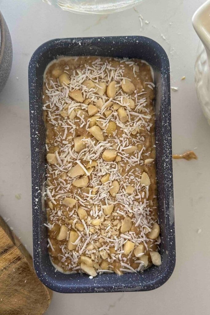 Sourdough Hawaiian banana bread batter in a loaf pan before going in oven.