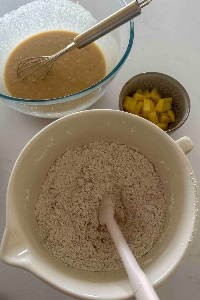 Sourdough Hawaiian banana bread dry ingredients mixed together in large white bowl.