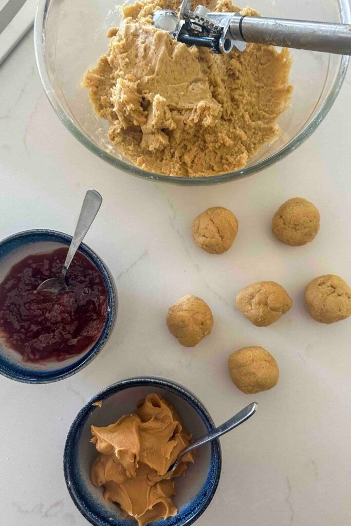 balls of sourdough peanut butter and jelly cookie dough to prepare sourdough peanut butter and jelly cookies.