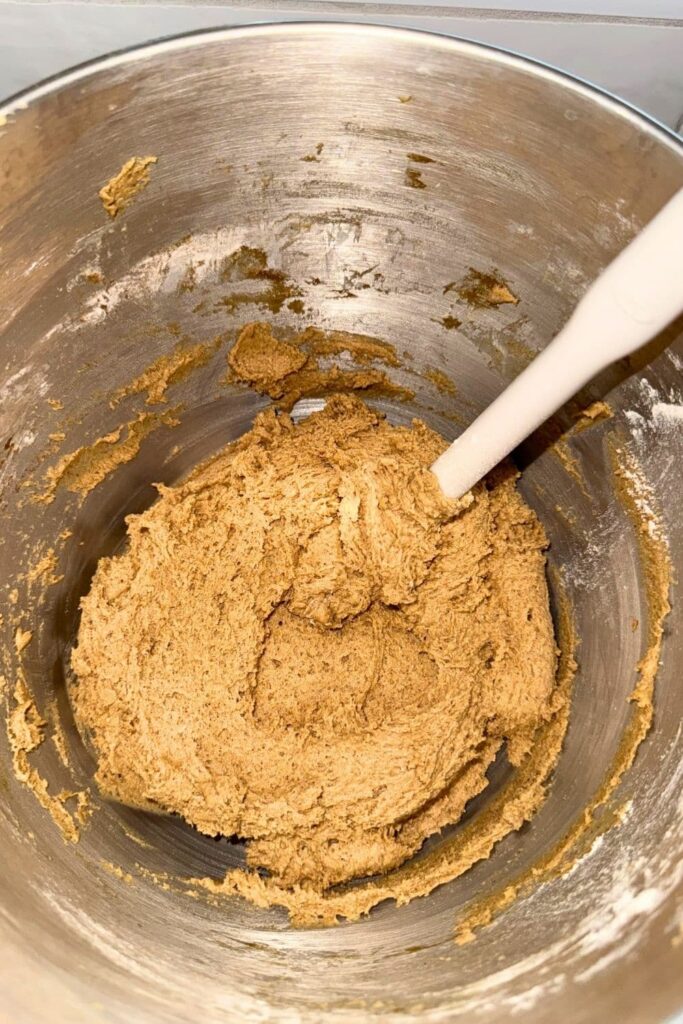 sourdough ginger molasses cookies cookie dough in mixing bowl.
