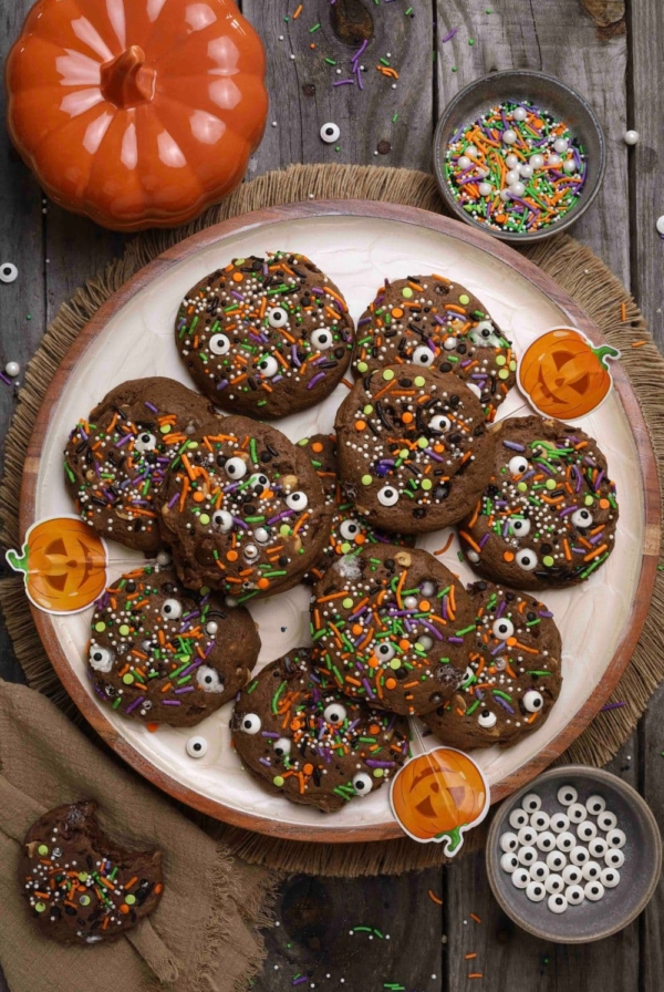 Sourdough Halloween cookies on a plate on a wooden table with Halloween stickers for decoration.