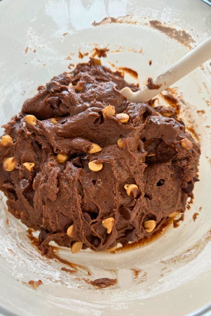 Cookie dough in a bowl for sourdough Halloween cookies.