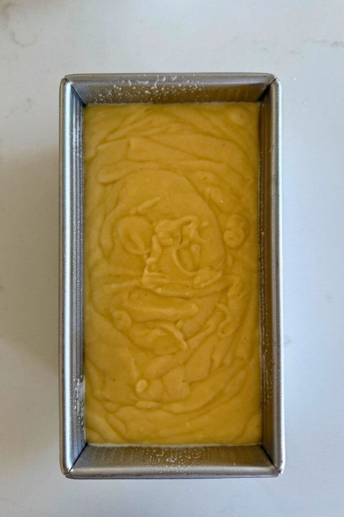 Sourdough Lemon loaf batter in loaf pan.