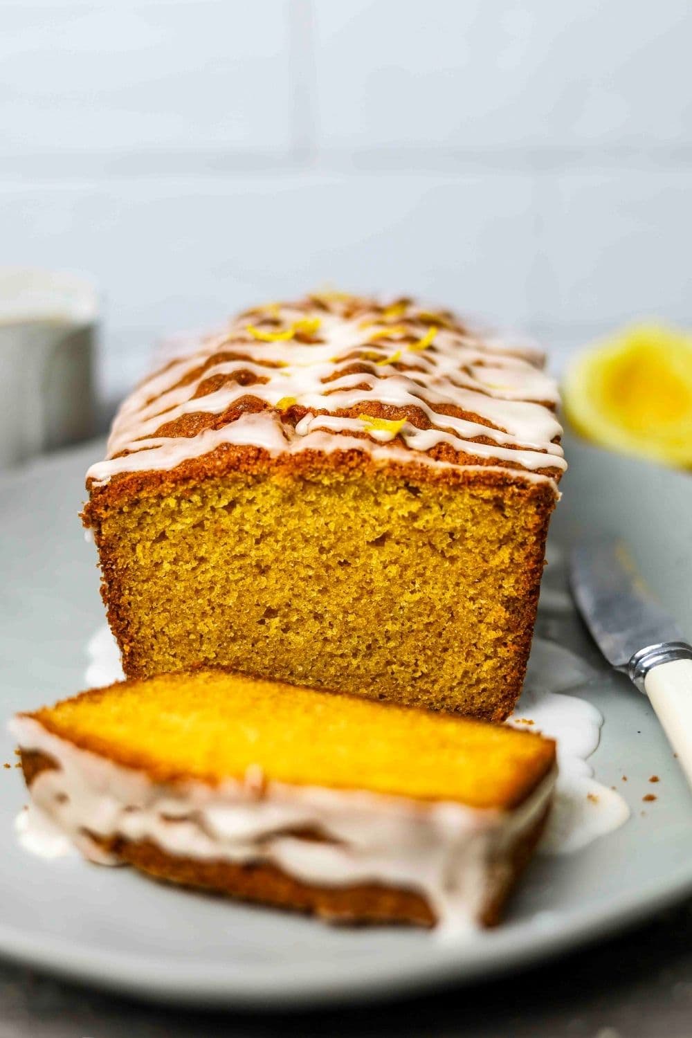 Sourdough Lemon loaf sliced on serving plate.