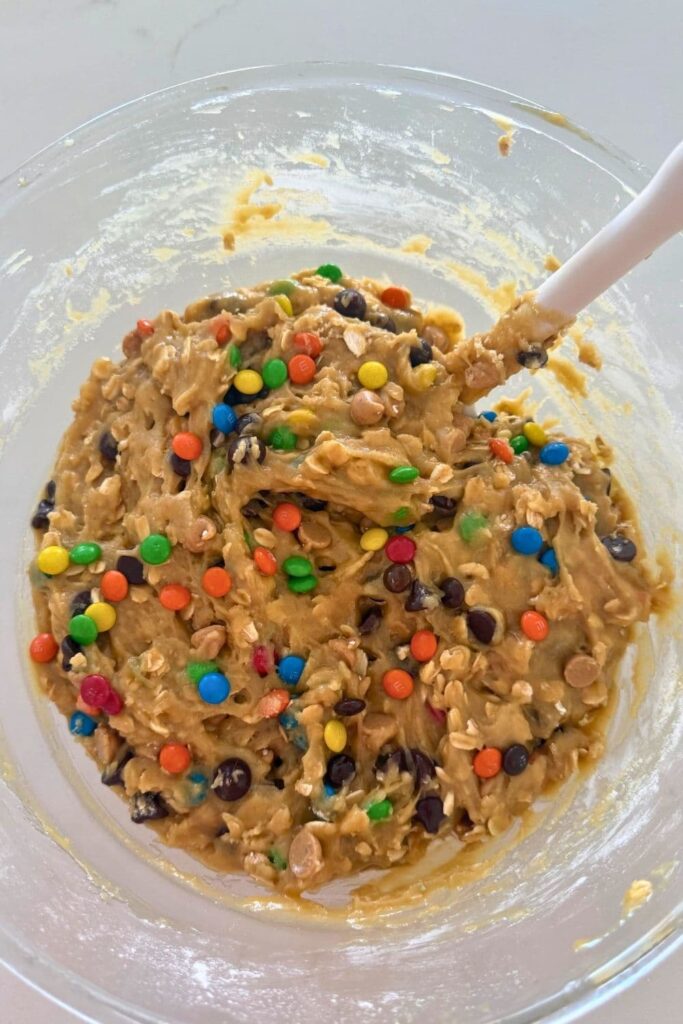 Sourdough monster cookie dough mixed together in a bowl.